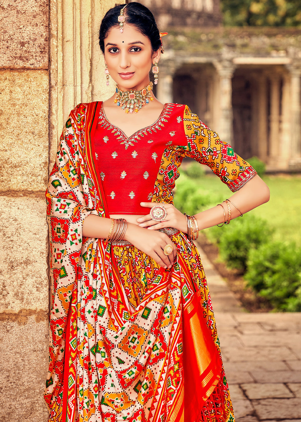 Orange & Red Patola Printed Banarasi Silk Lehenga Choli with Embroidery Work