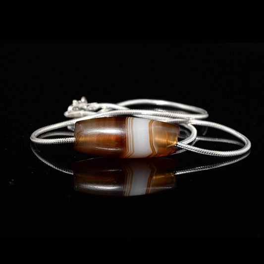 A Near Eastern Banded Agate set as a pendant, ca. 1st millennium BCE