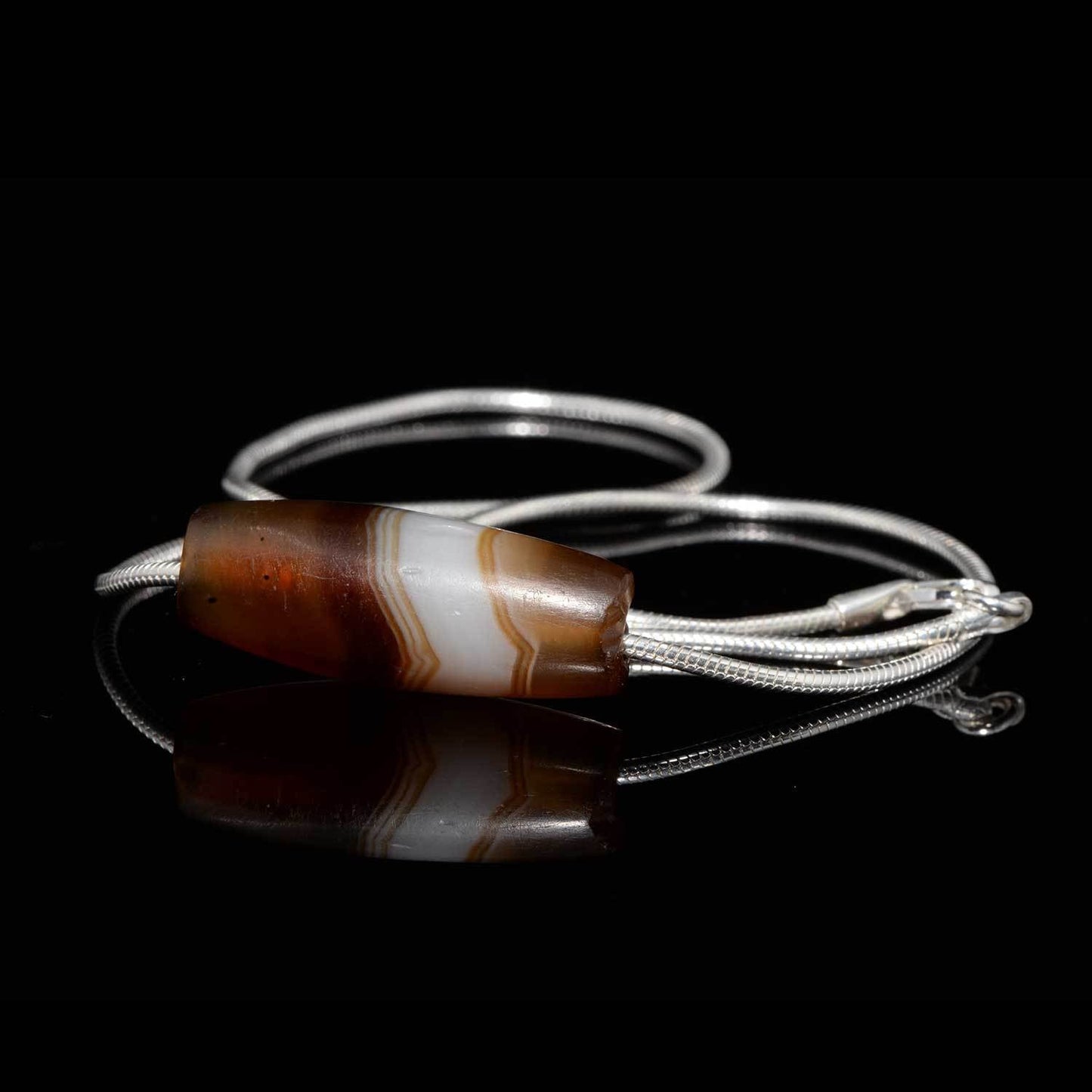 A Near Eastern Banded Agate set as a pendant, ca. 1st millennium BCE