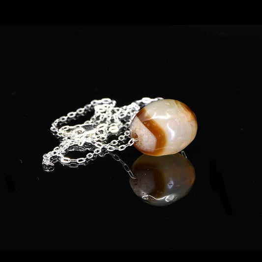 A Near Eastern Banded Agate Bead set as a pendant, ca. 1st millennium BCE