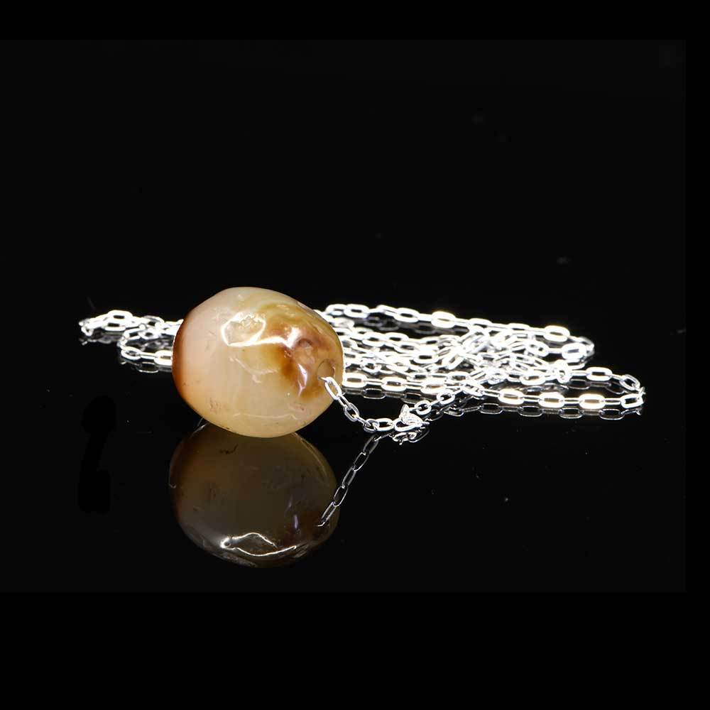 A Near Eastern Banded Agate Bead set as a pendant, ca. 1st millennium BCE