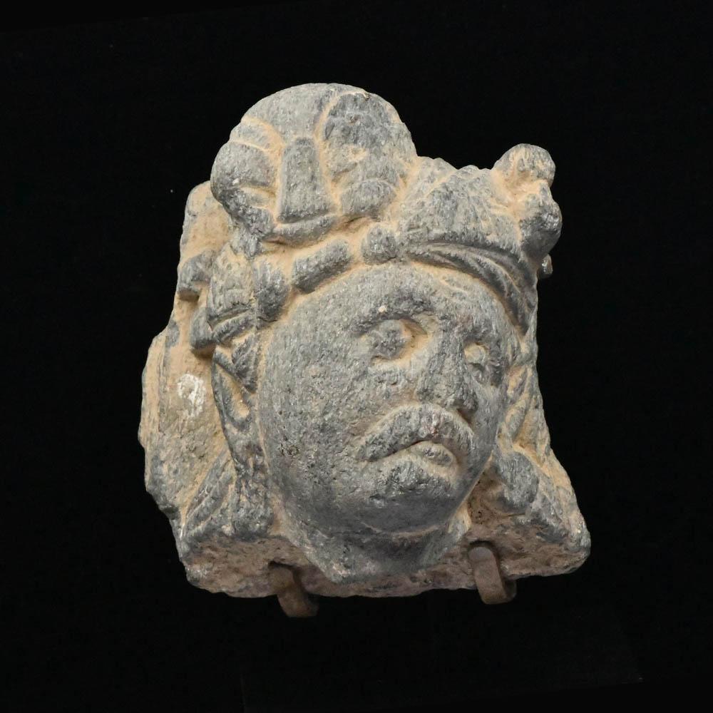 A Gandhara Schist Head of a Devotee, ca 1st century BCE/CE