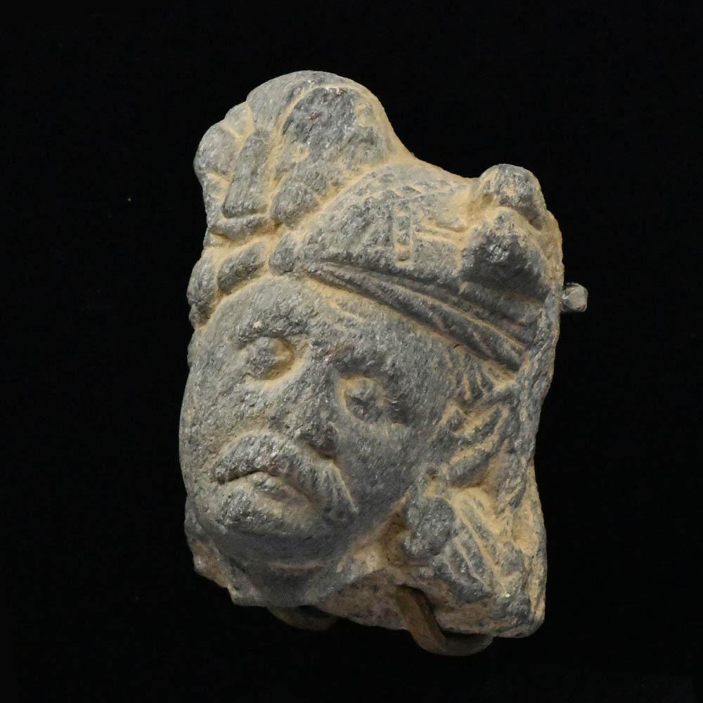 A Gandhara Schist Head of a Devotee, ca 1st century BCE/CE