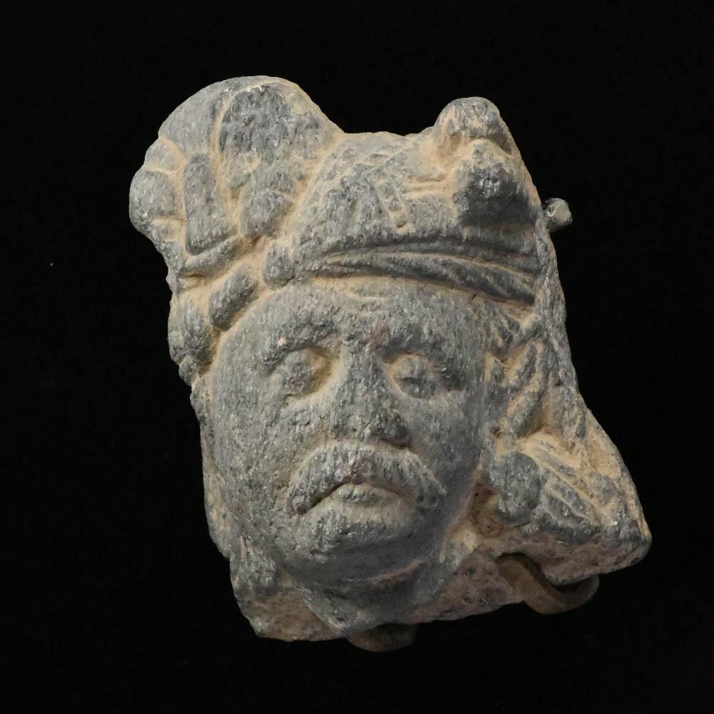 A Gandhara Schist Head of a Devotee, ca 1st century BCE/CE