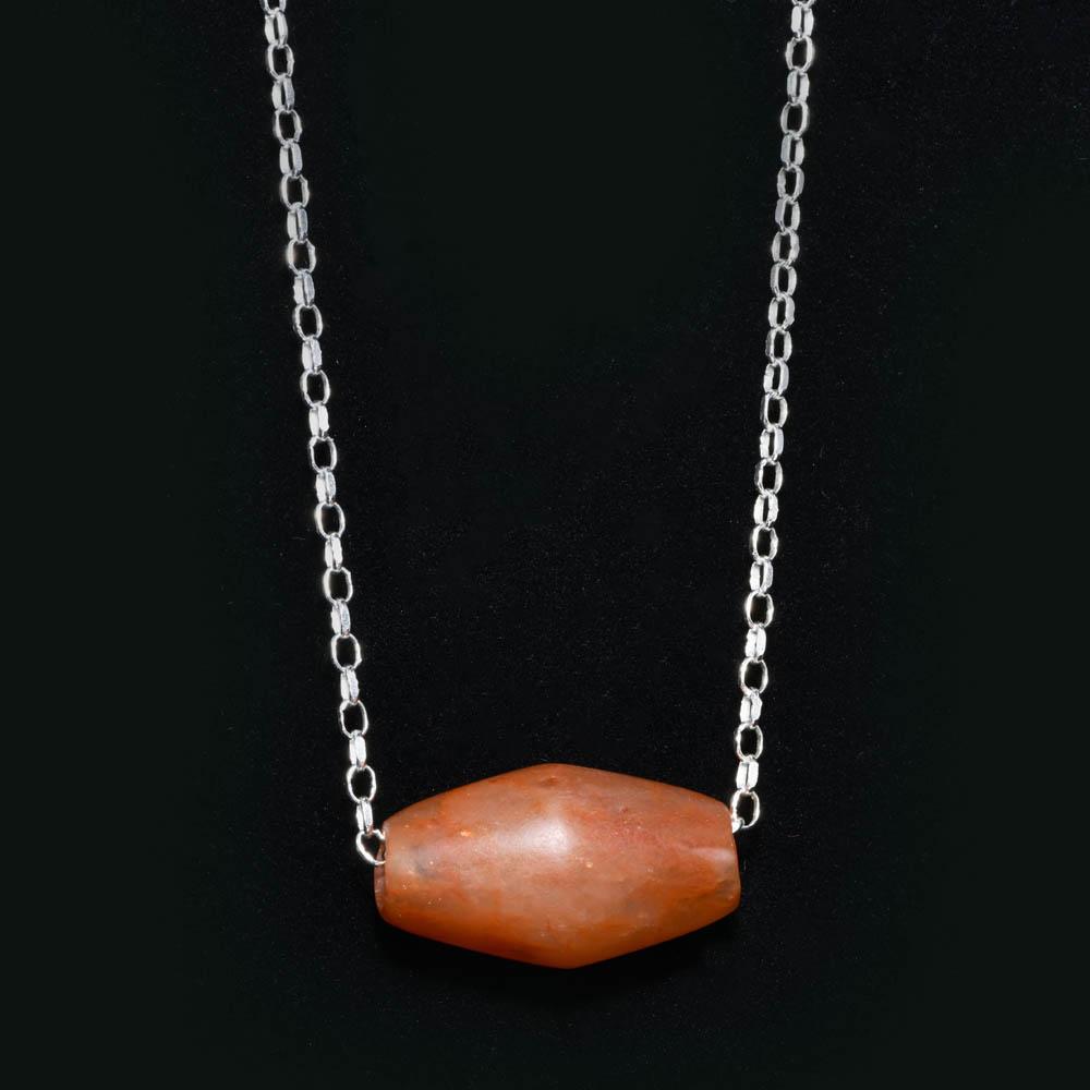 An Egyptian Carnelian Bead, Middle Kingdom, Dynasty 11- 12, ca. 2040 - 1786 BCE