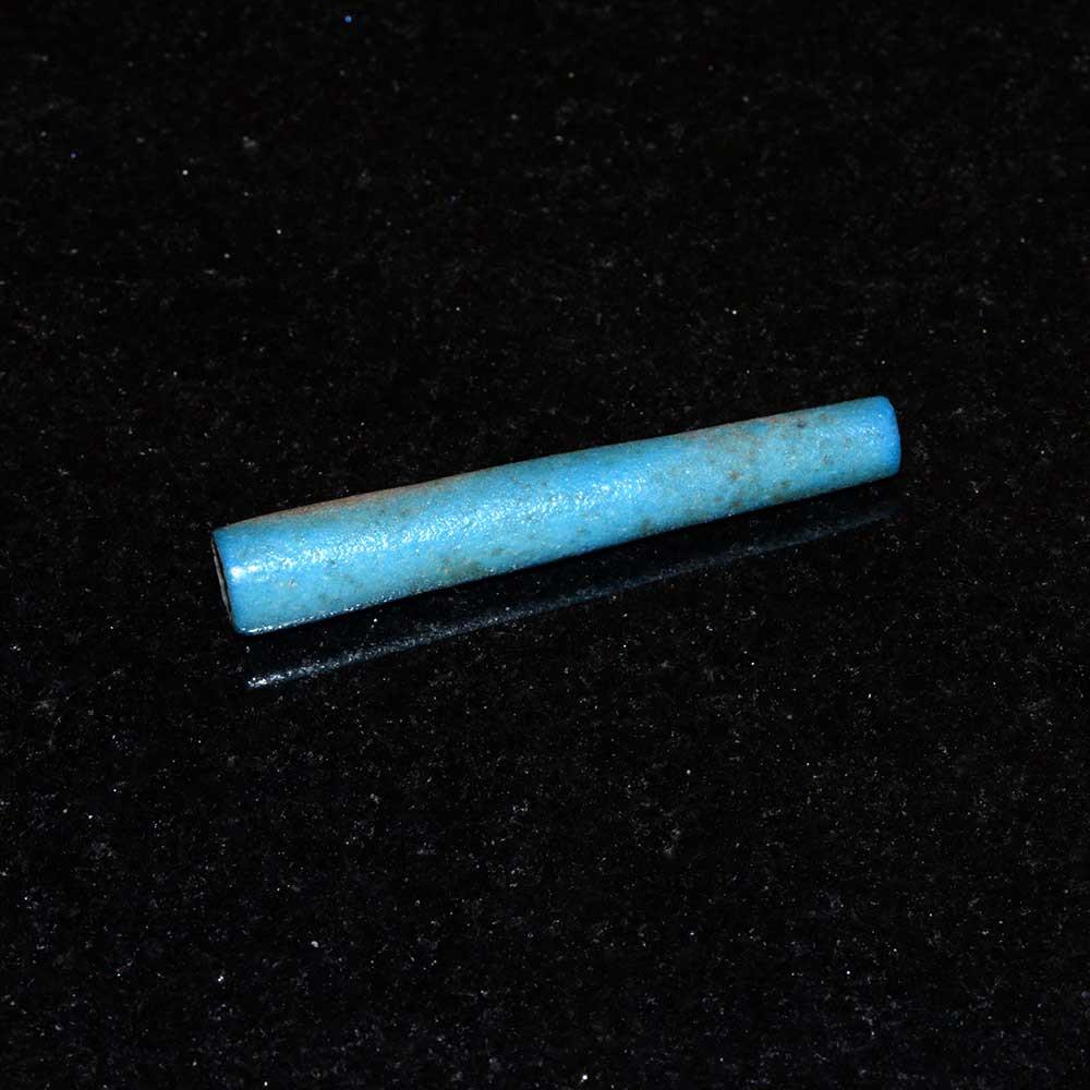 A rare Egyptian Blue Faience Flail Bead, New Kingdom, ca. 1550-1069 BCE