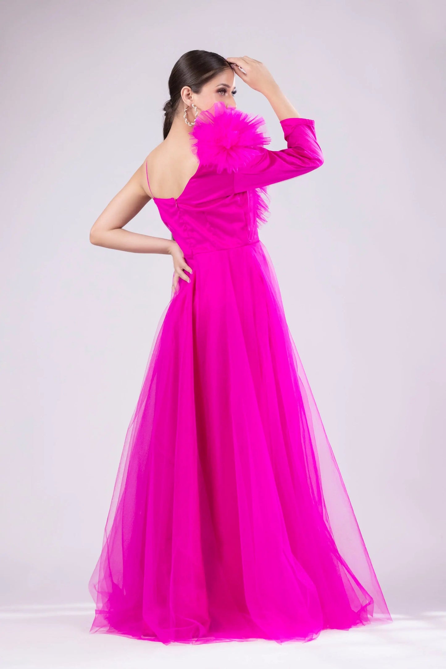 Hot pink gown with ruffle on shoulder