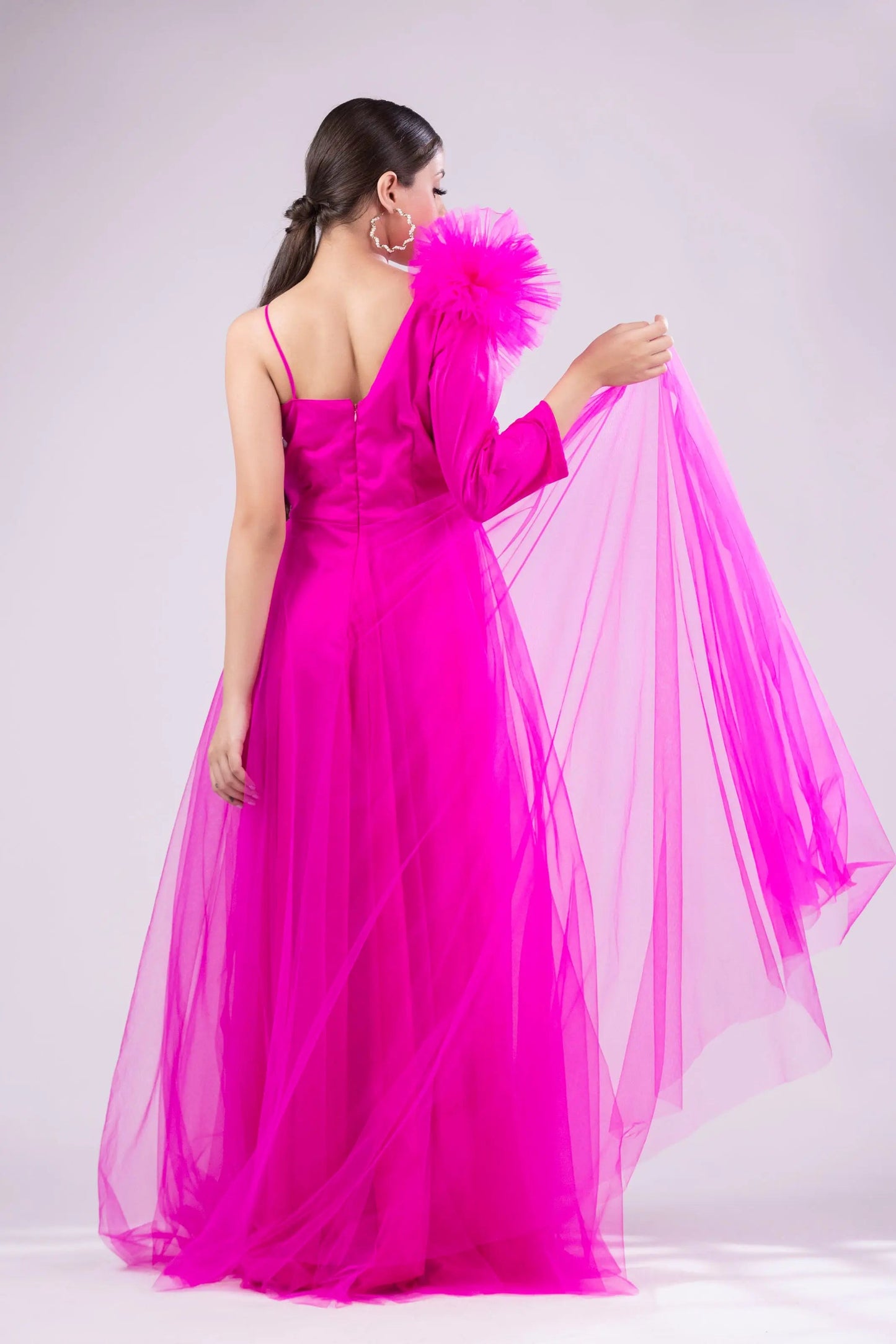 Hot pink gown with ruffle on shoulder