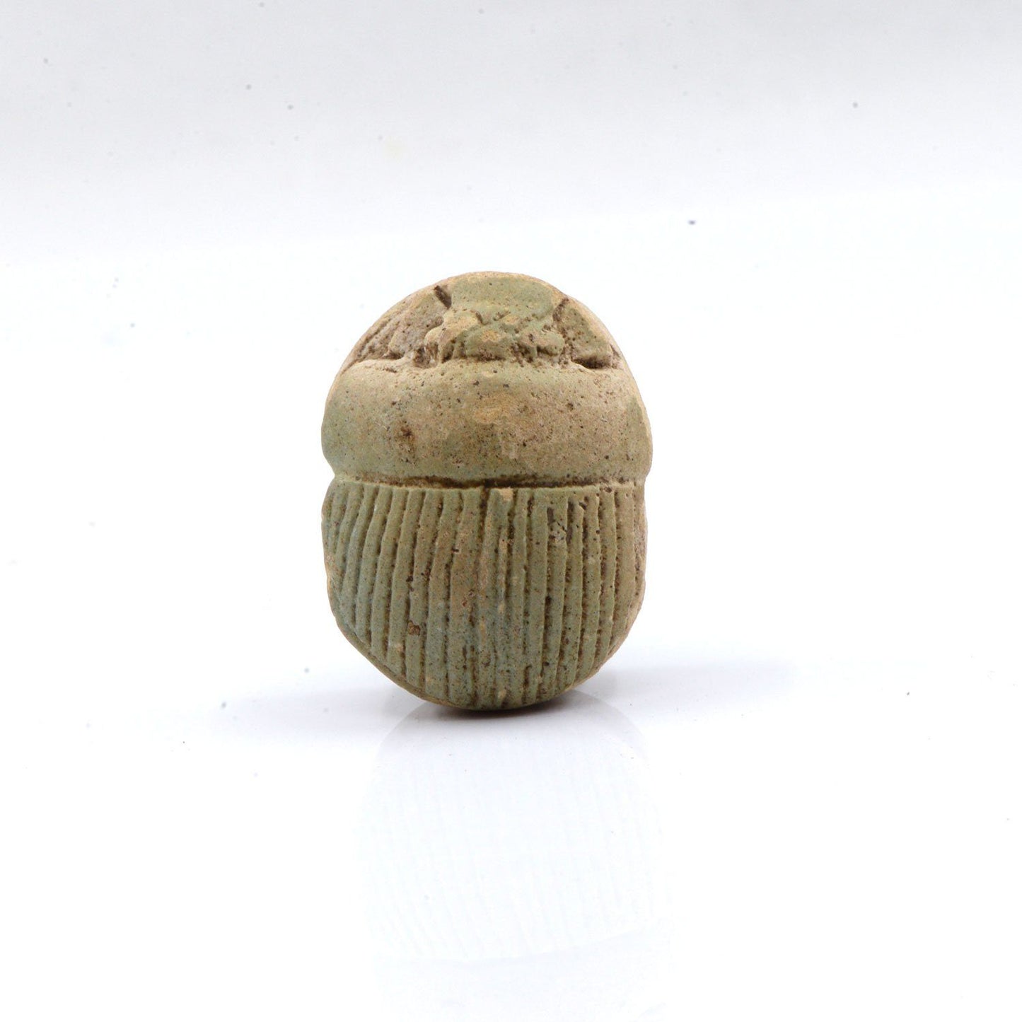 A large Egyptian Pale Green Glazed Scarab, Late Period, Dynasty 26, ca. 664 - 525 BCE