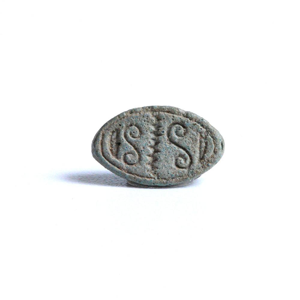 An Egyptian Blue Faience Design Scaraboid, 2nd Intermediate Period, ca. 1650 - 1550 BCE