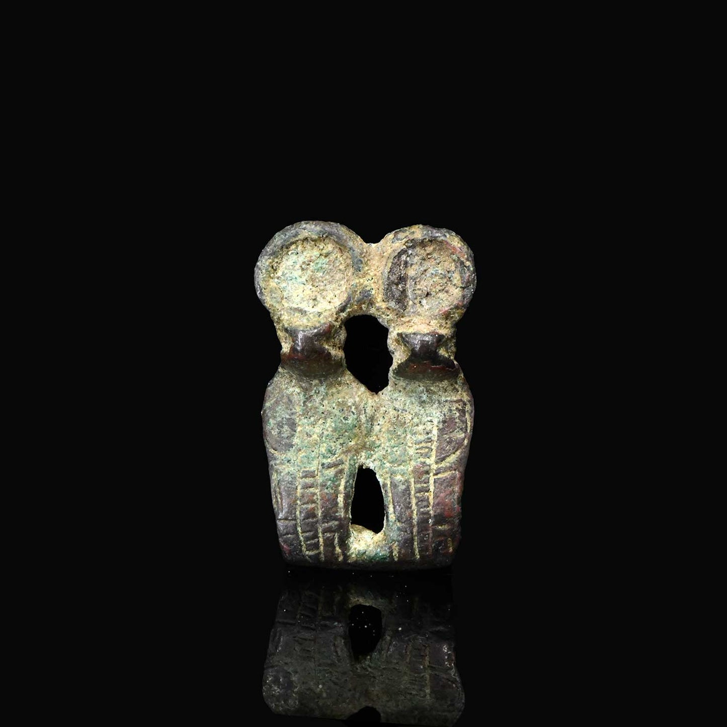 An Egyptian Bronze Double Uraeus Amulet, Late Period, 25th - 26th Dynasty, ca. 745 - 525 BCE