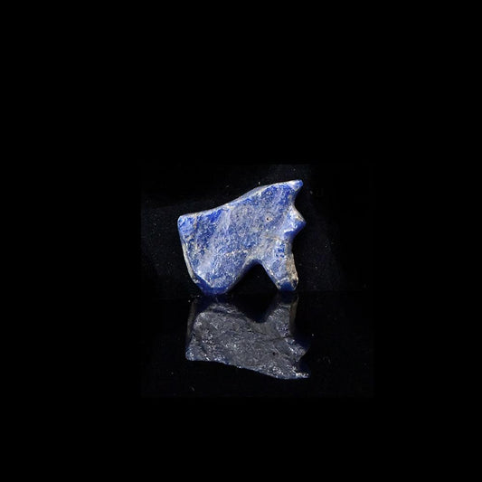 An Egyptian Glass Wedjet Eye Amulet, Late Period, ca. 664 - 332 BCE