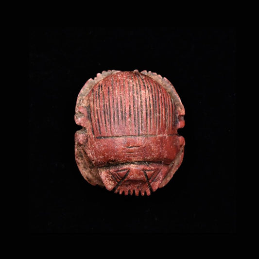 An Egyptian Red Glazed Steatite Scarab, Late Period, ca. 664 - 332 BCE