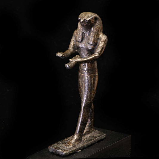 An Egyptian Gold-Inlaid Bronze Falcon, Third Intermediate Period, ca. 900 - 600 BCE