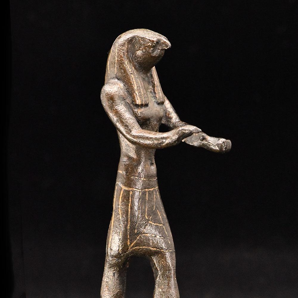 An Egyptian Gold-Inlaid Bronze Falcon, Third Intermediate Period, ca. 900 - 600 BCE