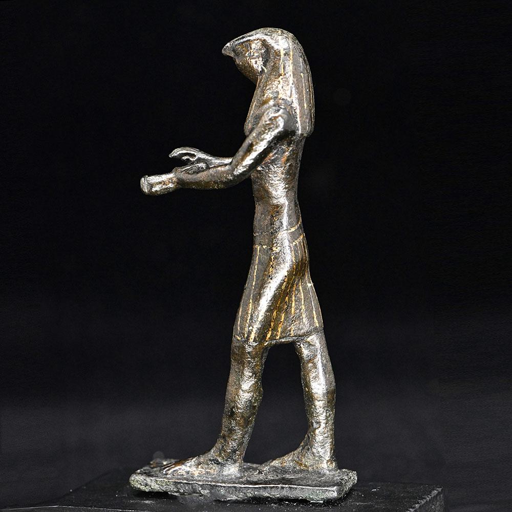 An Egyptian Gold-Inlaid Bronze Falcon, Third Intermediate Period, ca. 900 - 600 BCE
