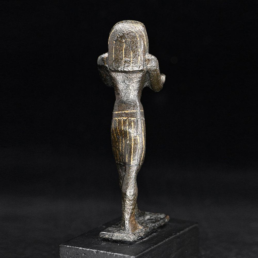 An Egyptian Gold-Inlaid Bronze Falcon, Third Intermediate Period, ca. 900 - 600 BCE