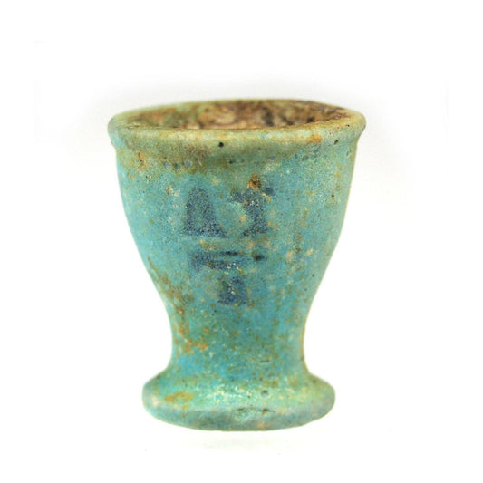 An Egyptian Blue-glazed Oil Cup, Dynasty 26, ca. 664-525 BCE