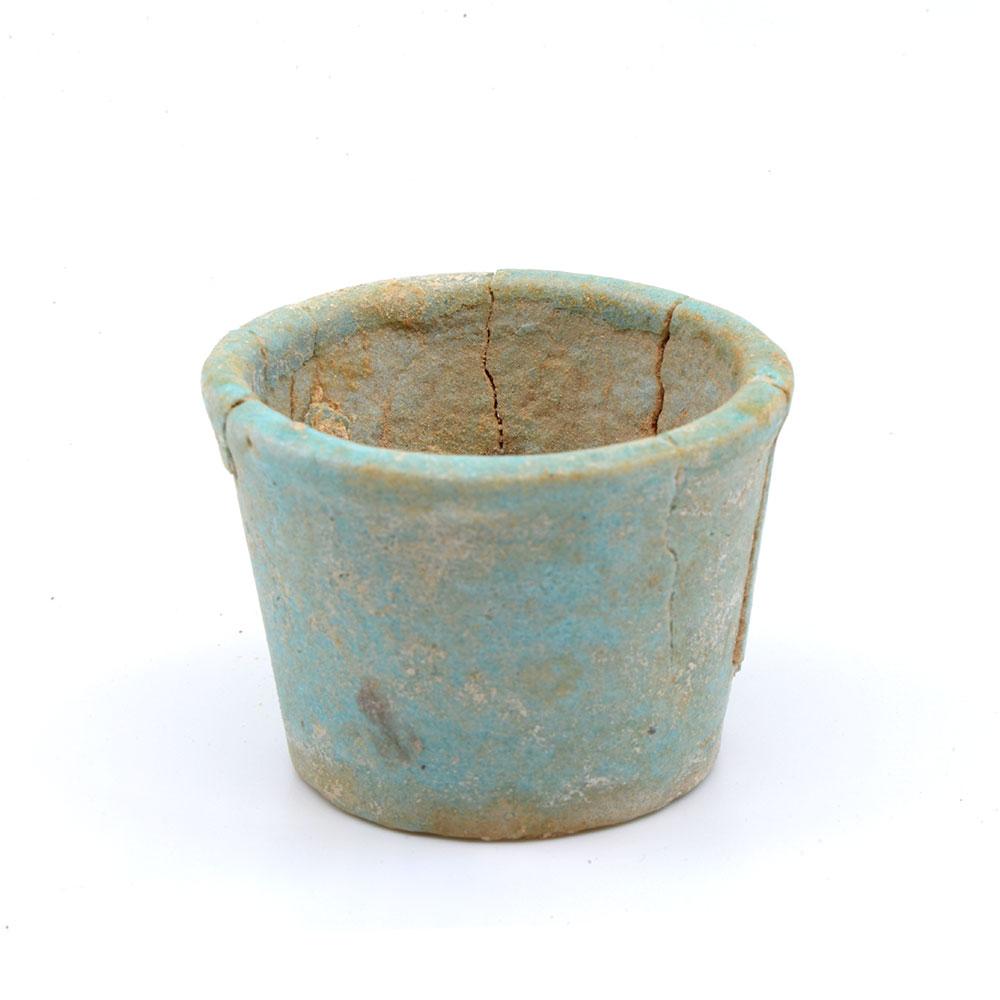 An Egyptian faience offering cup with contents, 26th Dynasty, ca. 664 - 525 BCE