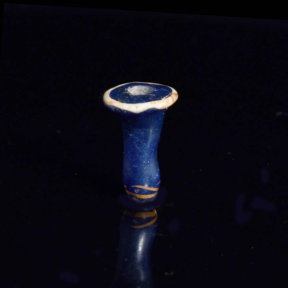 An Egyptian Blue Glass Ear Stud, 18th - 19th Dynasty, ca. 1350 - 1250 BCE