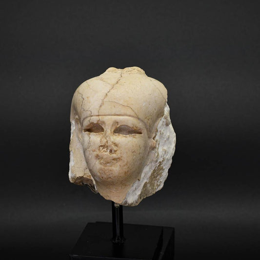 An Egyptian Carved Stone Head of Isis, Ptolemaic Period, ca. 332 - 30 BCE