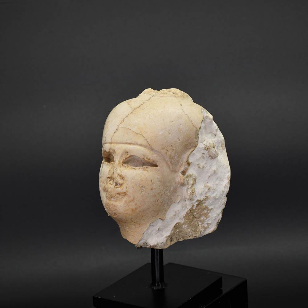 An Egyptian Carved Stone Head of Isis, Ptolemaic Period, ca. 332 - 30 BCE