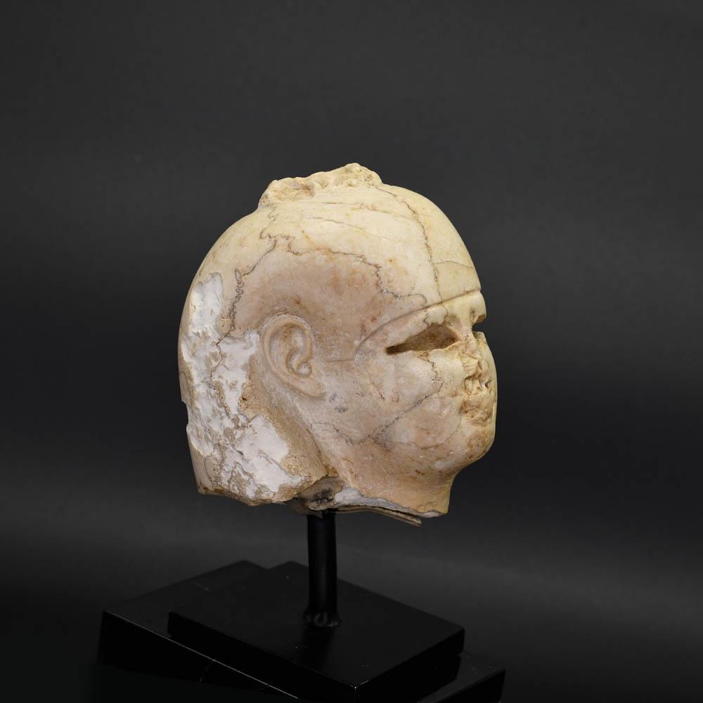 An Egyptian Carved Stone Head of Isis, Ptolemaic Period, ca. 332 - 30 BCE