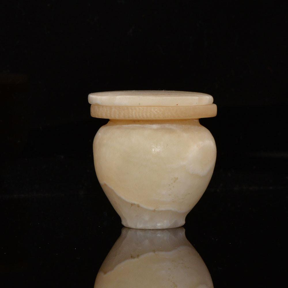 An Egyptian Alabaster Cosmetic Vessel with Lid, Middle Kingdom, ca. 2040-1786 BCE