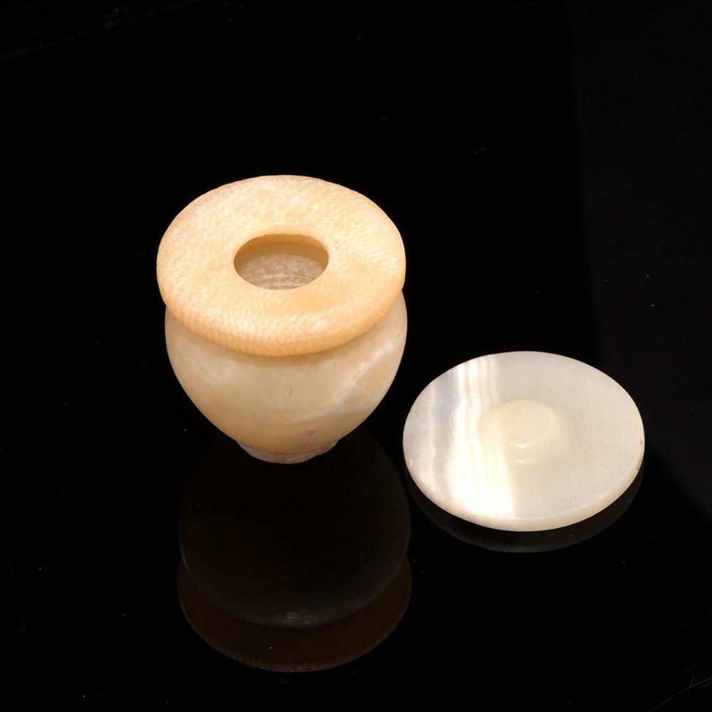 An Egyptian Alabaster Cosmetic Vessel with Lid, Middle Kingdom, ca. 2040-1786 BCE