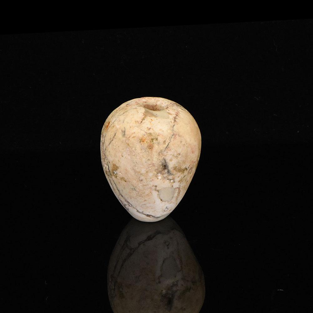 An Egyptian Indurated Limestone Mace Head, Pre-Dynastic Period, ca. 3500 - 3200 BCE