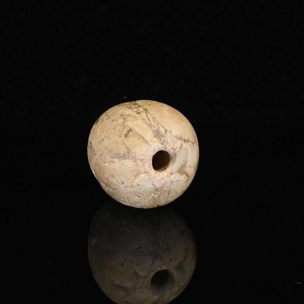 An Egyptian Indurated Limestone Mace Head, Pre-Dynastic Period, ca. 3500 - 3200 BCE