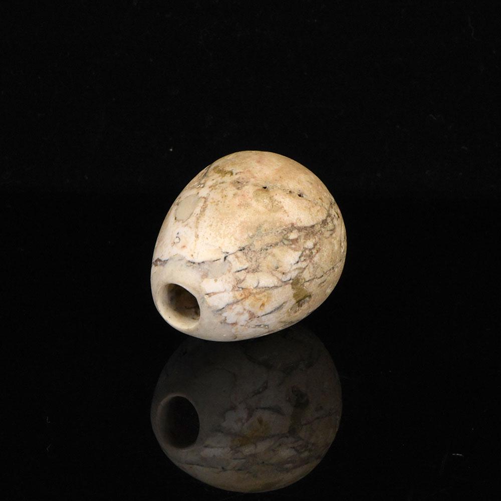 An Egyptian Indurated Limestone Mace Head, Pre-Dynastic Period, ca. 3500 - 3200 BCE