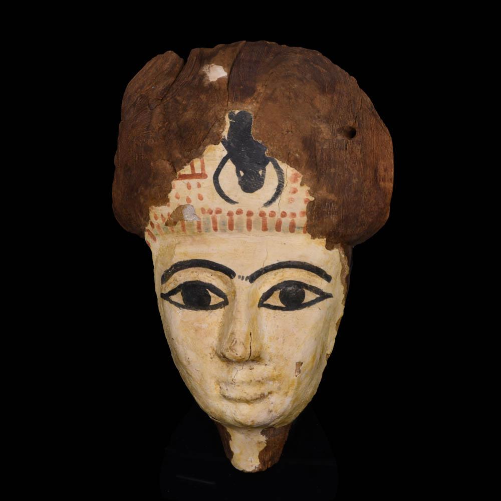 An Egyptian Wooden Mummy Mask, 21st Dynasty, ca. 1069 - 945 BCE