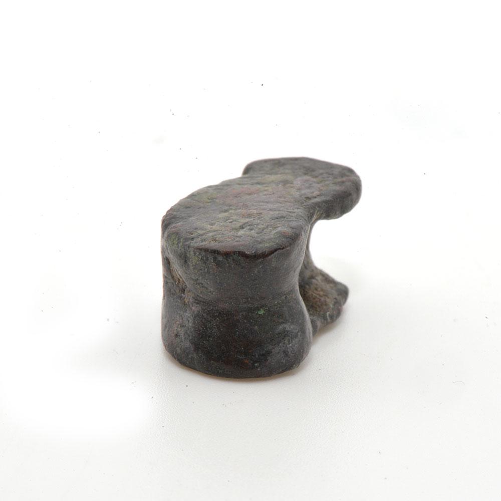 A Greek Bronze Astragalus (knucklebone) Gaming Piece, Hellenistic Period ca. 4th - 2nd century BCE