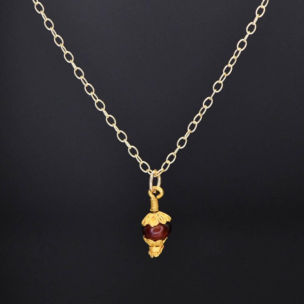 A Greek Gold and Garnet Pendant, Hellenistic Period, ca. 3rd - 1st century BCE