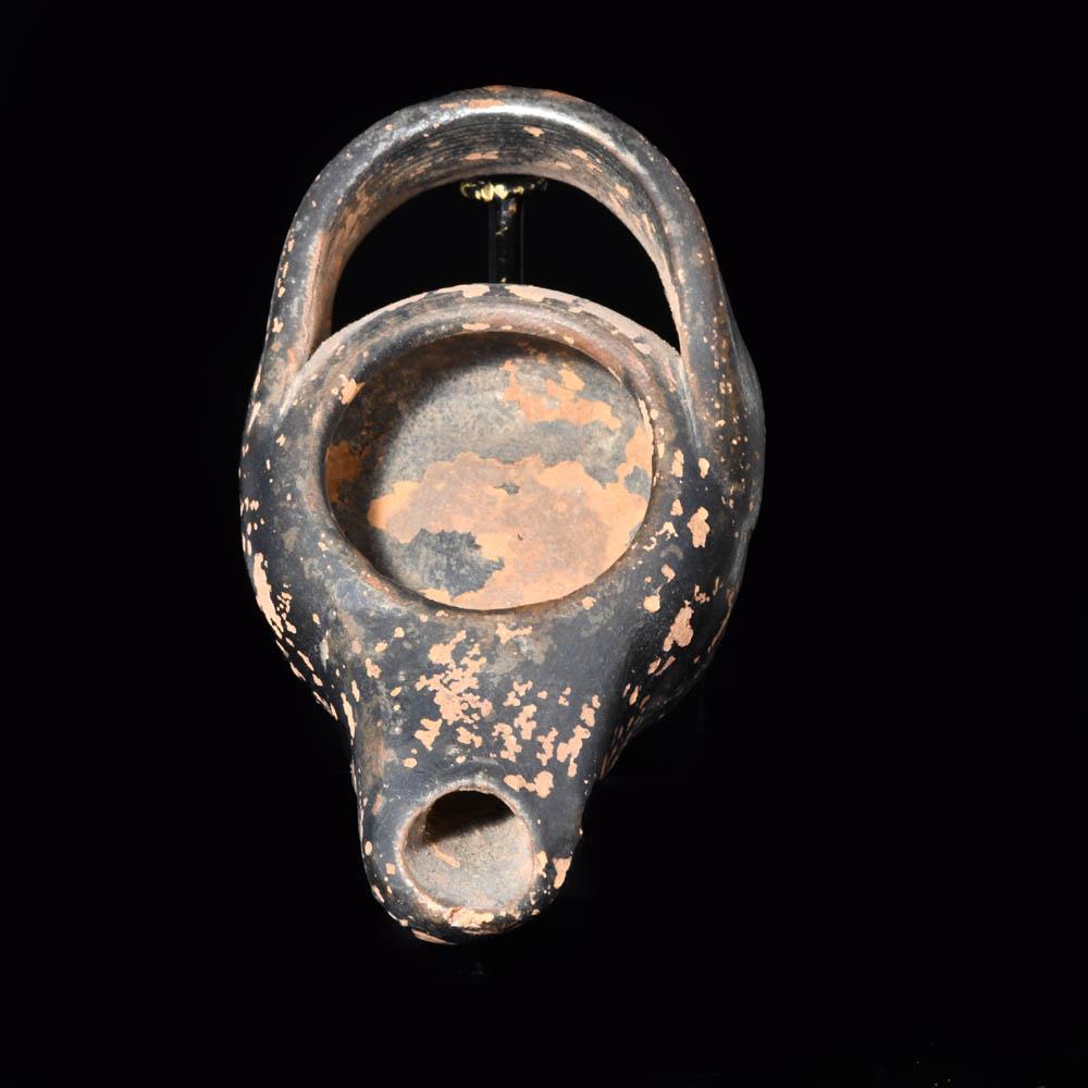 An Attic Black Glazed Oil Lamp, ca. 5th century BCE