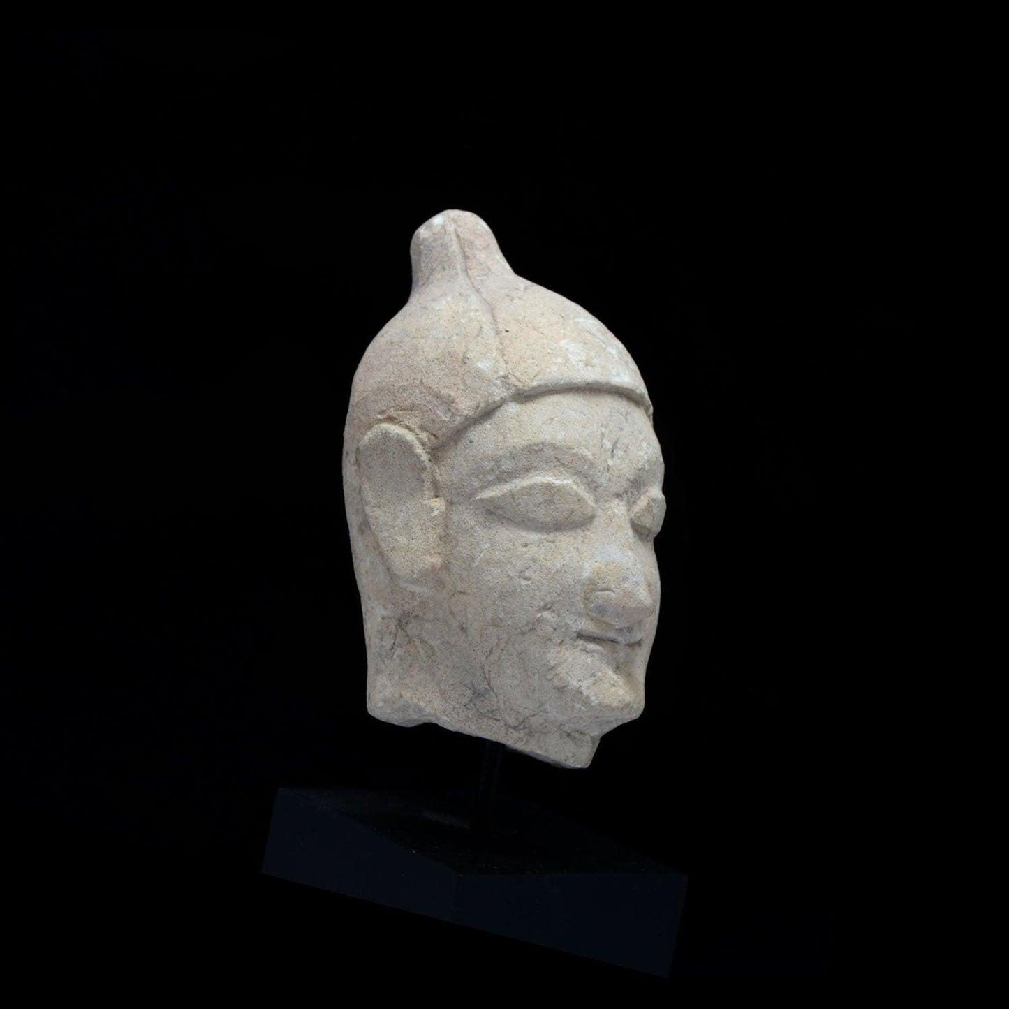 A Cypriot Limestone Head of a Youth, Archaic Period, 600-500 BCE