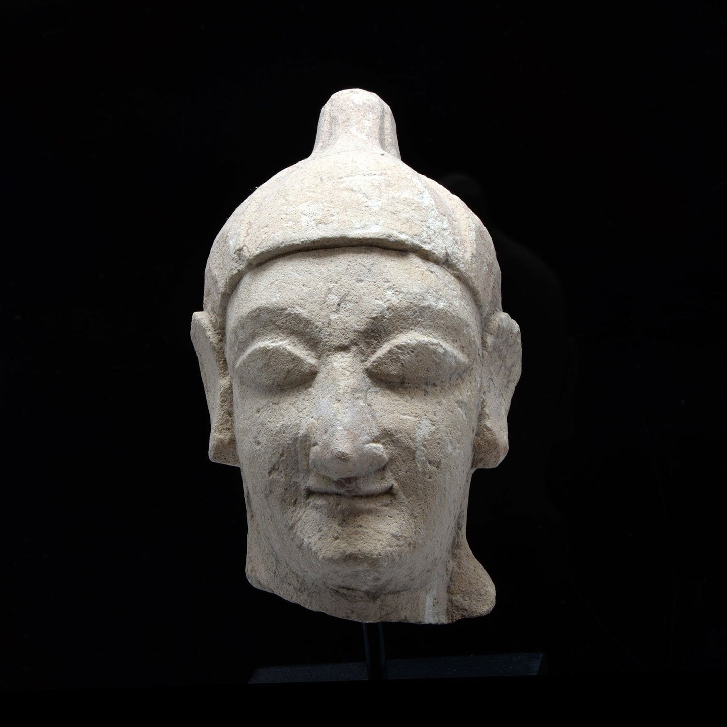 A Cypriot Limestone Head of a Youth, Archaic Period, 600-500 BCE