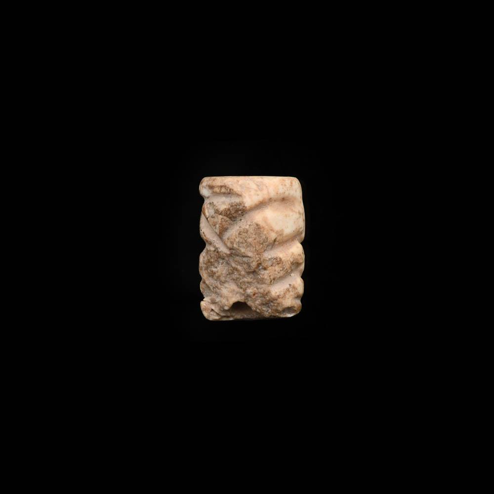 A Mesopotamian Marble Cylinder Seal, Jemdet Nasr Period, ca 3100 - 2700 BCE