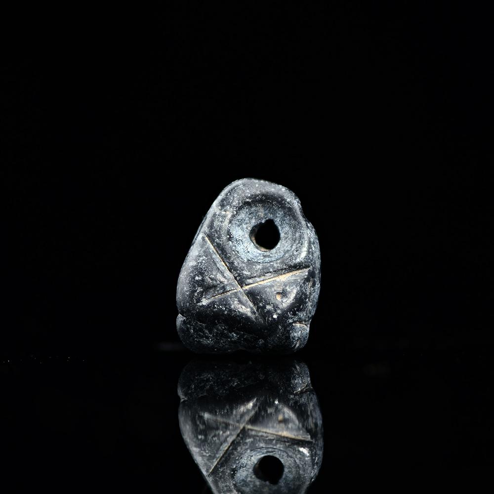 A Mesopotamian Triangular Pendant Seal, Late Chalcolithic Period, ca. 4500-3200 BCE