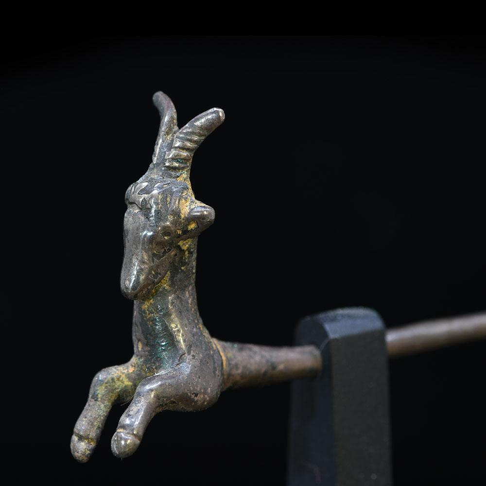 A Near Eastern silver Goat Pin, ca. 200 BCE - 200 CE