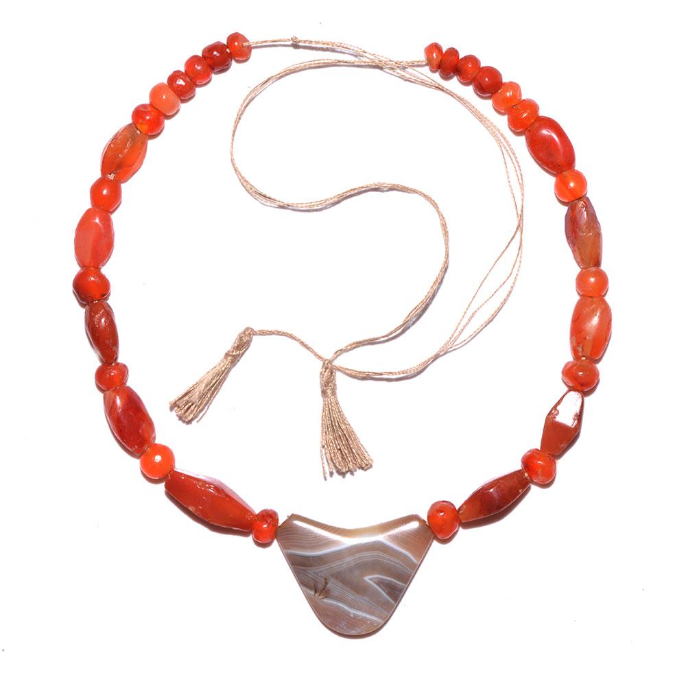 An Achaemenid Carnelian and Banded Agate Bead Necklace, ca. 550 - 332 BCE