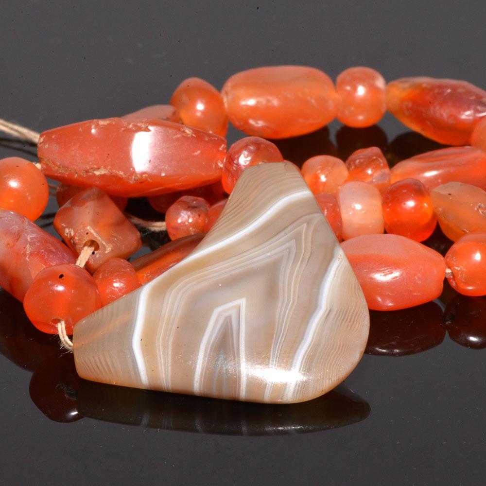 An Achaemenid Carnelian and Banded Agate Bead Necklace, ca. 550 - 332 BCE