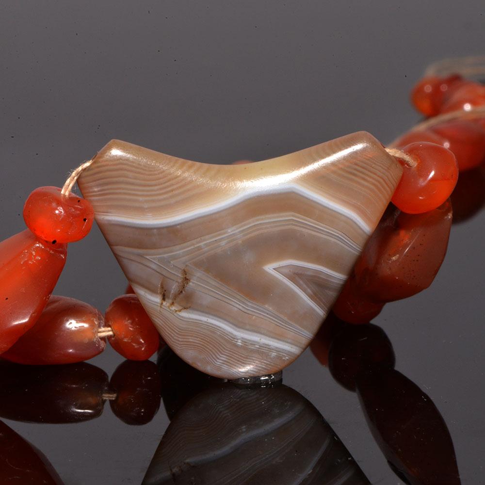 An Achaemenid Carnelian and Banded Agate Bead Necklace, ca. 550 - 332 BCE