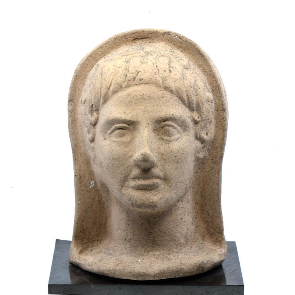 An Etruscan Terracotta Votive Head of A Youth, ca. 4th Century BCE