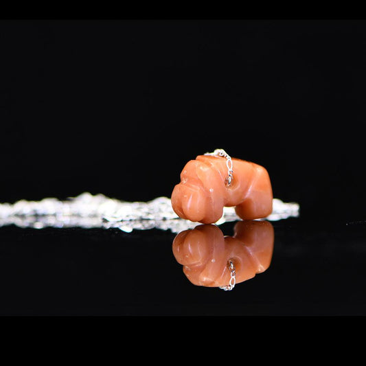 A Pre-Columbian Carnelian Worm Pendant, Tairona Culture, ca. 800 - 1500 CE