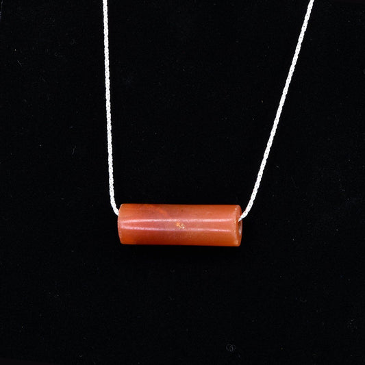 A fine Inca Carnelian Tube Bead, set as a pendant, ca 1400-1560 CE