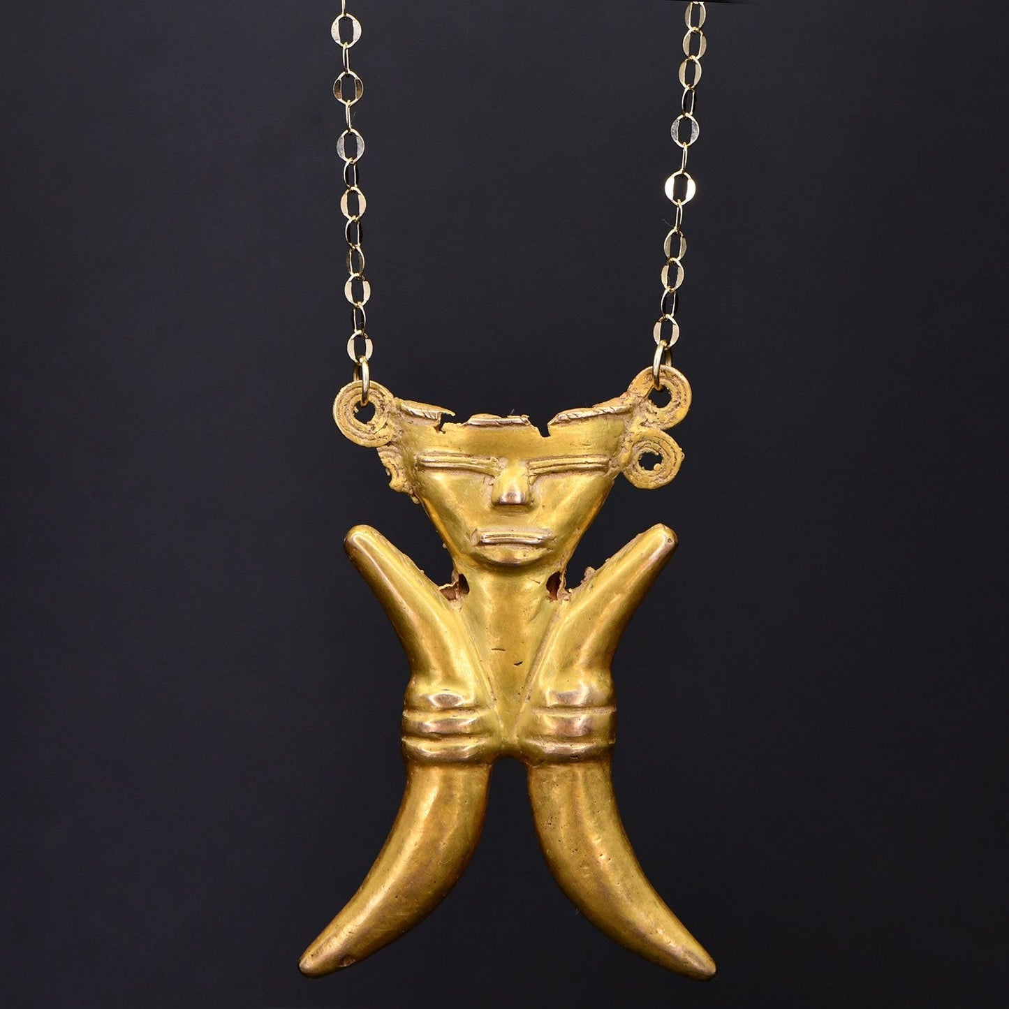 A Pre-Columbian Gold Figural Pendant, Calima, Colombia, ca. 800 - 1000 CE