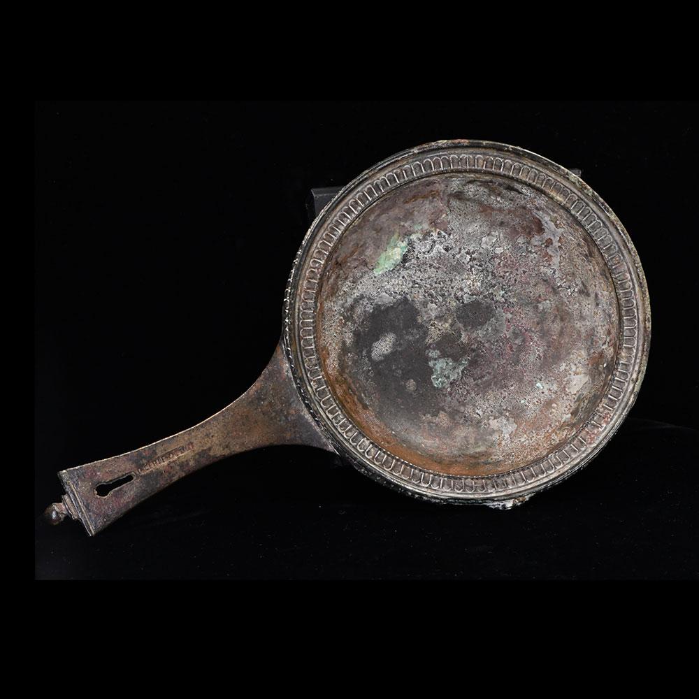 A Roman Military bronze Skillet with maker mark of Publius Cipius Polybius, Flavian Period (65-85 CE)