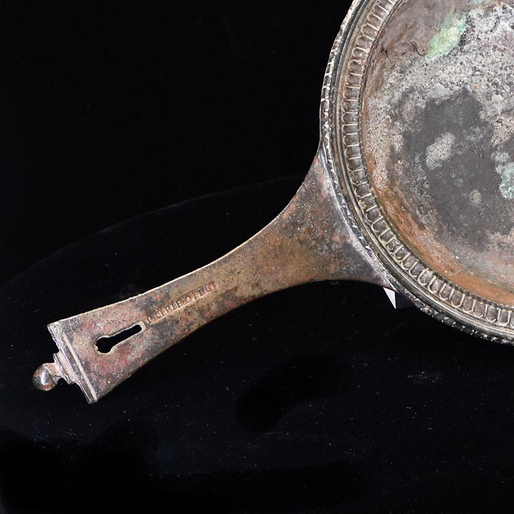 A Roman Military bronze Skillet with maker mark of Publius Cipius Polybius, Flavian Period (65-85 CE)